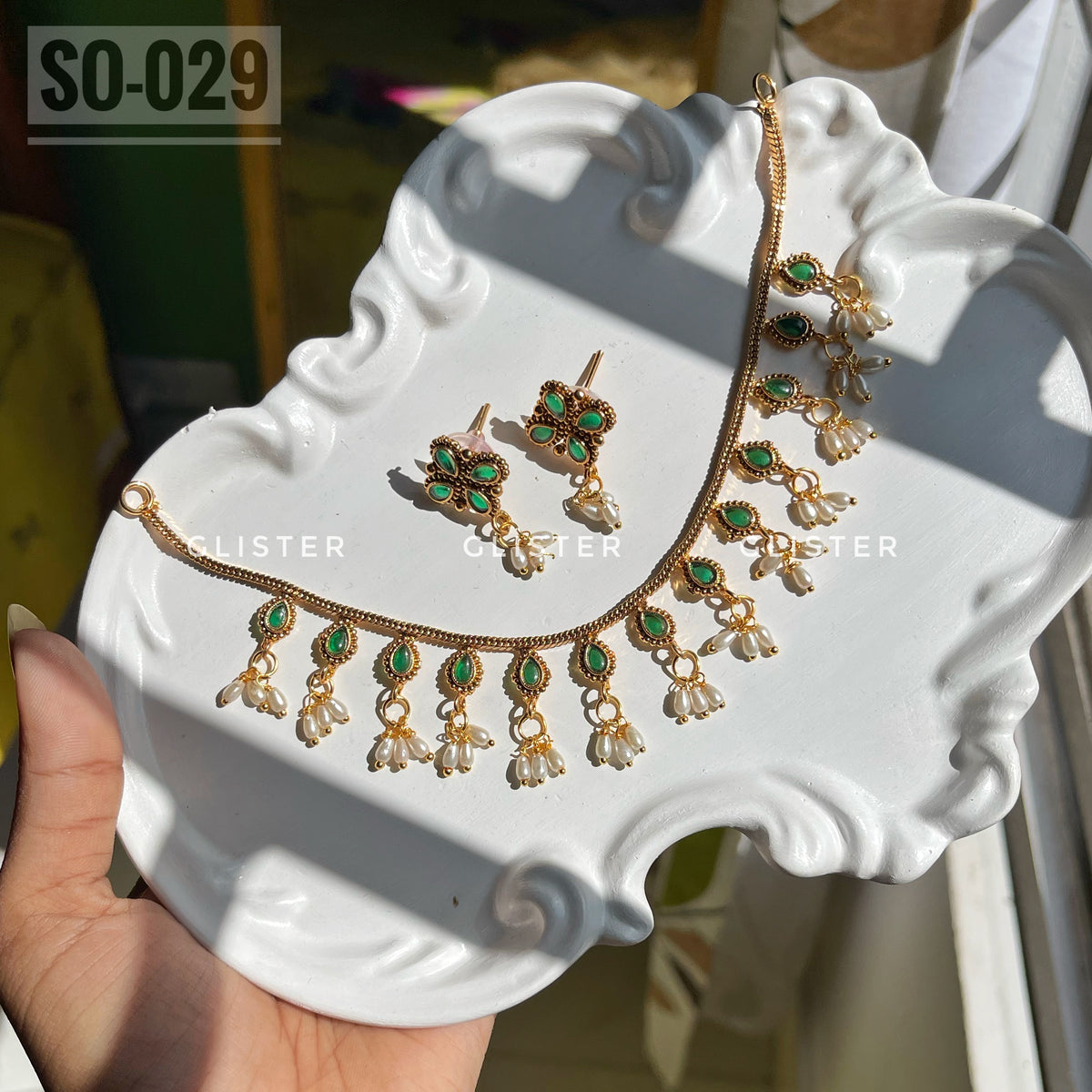 Gold-tone necklace and stud earrings with green accents and bead drops. SO-029.