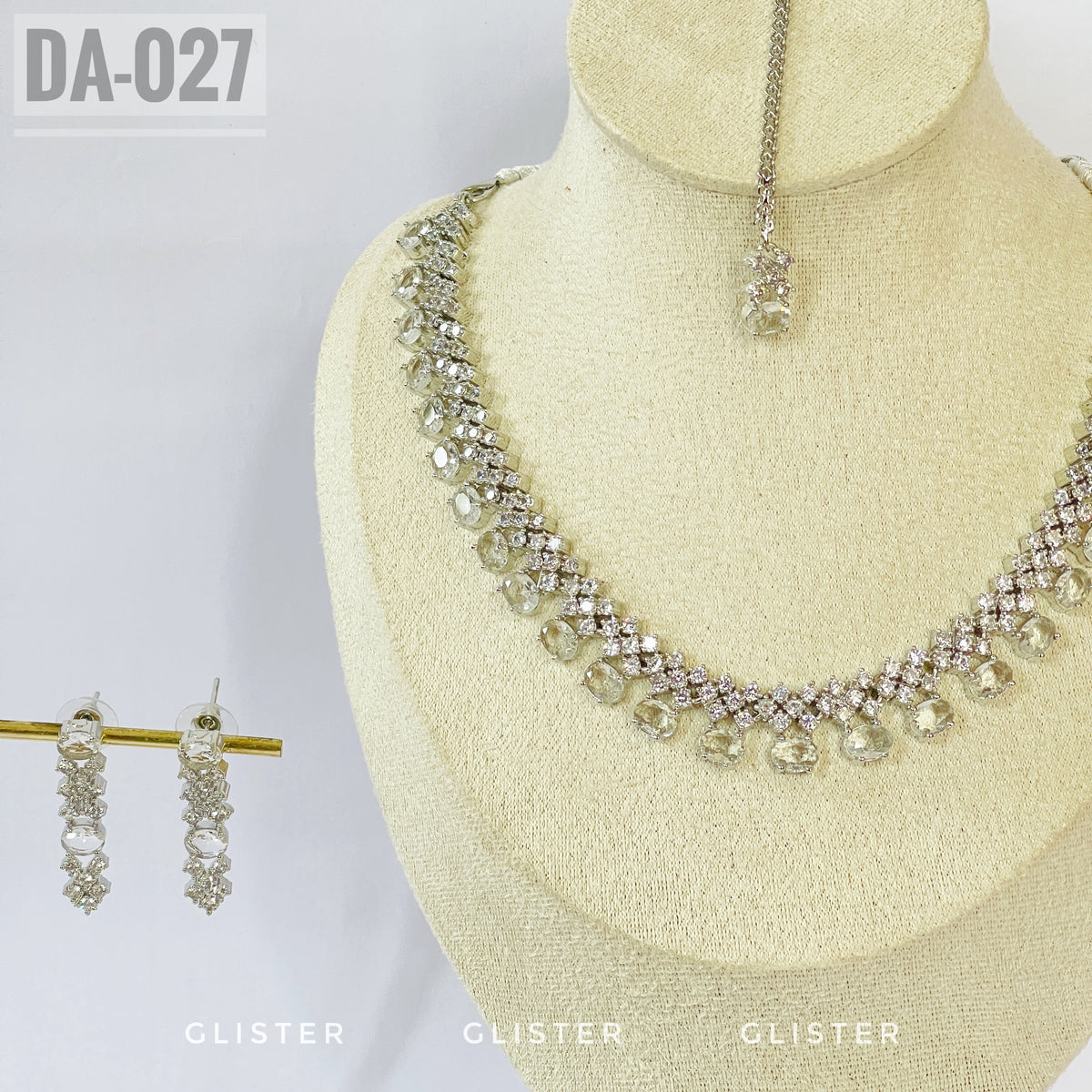 Silver-tone clear teardrop necklace and earrings close-up with a matching forehead ornament