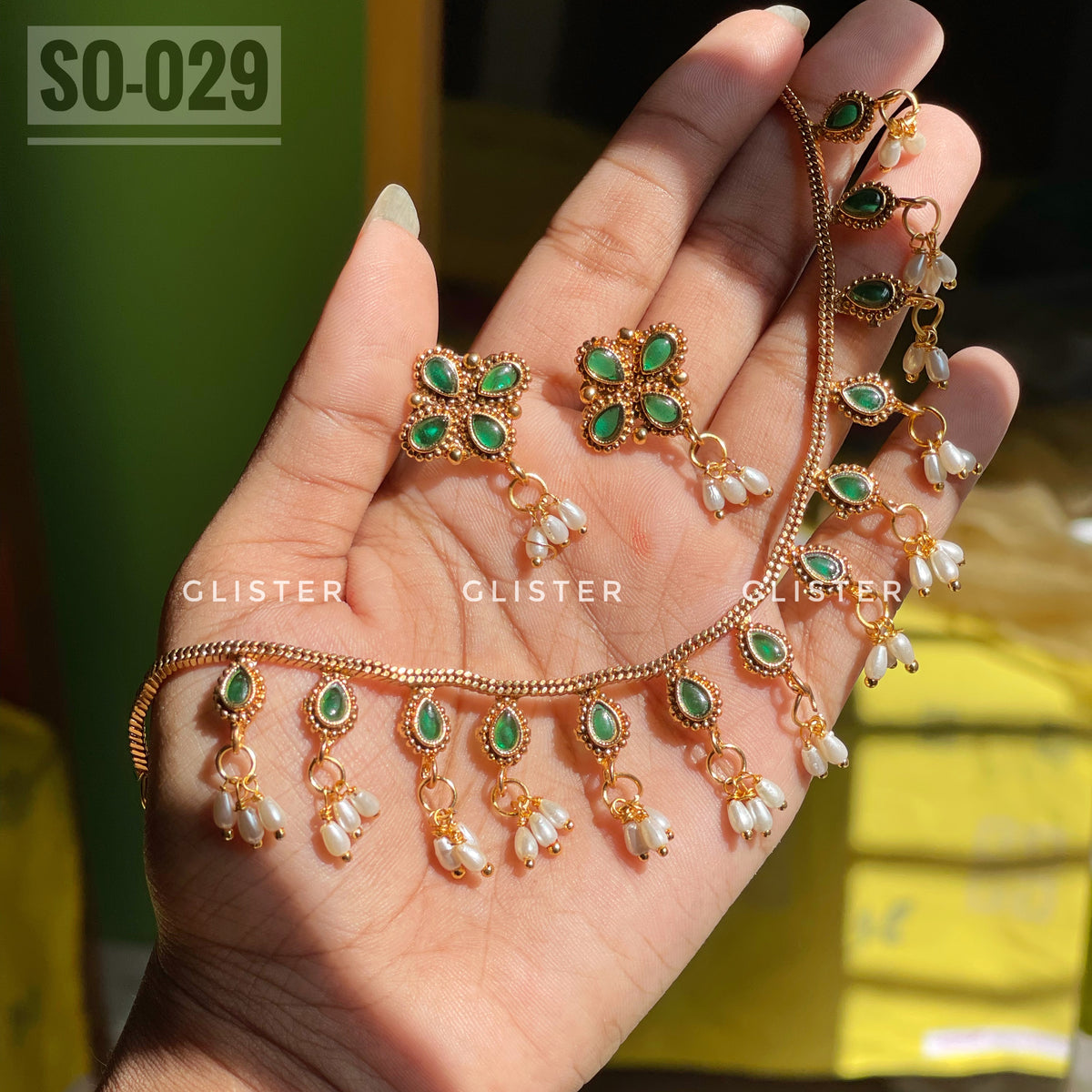 Gold-tone necklace and stud earrings with green accents and bead drops. SO-029.