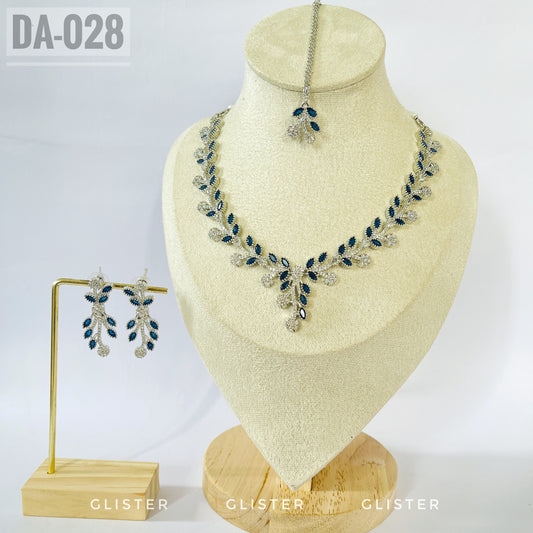 Silver-tone dark blue leaf necklace and earrings on a bust with a matching forehead ornament
