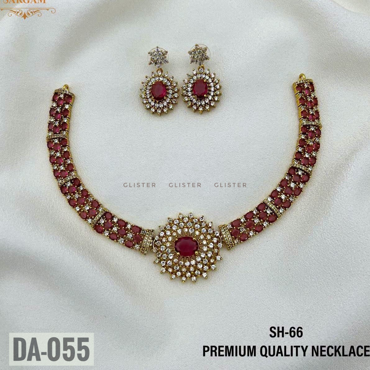 Glister DA-055: A necklace with rows of pink oval accents and a round floral centerpiece, paired with matching oval drop earrings.