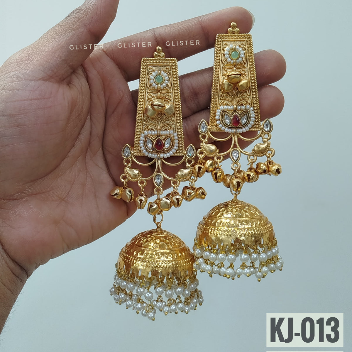 Glister KJ-013: Long rectangular earrings with light blue floral accents, small hanging charms and large bell-shaped drops edged with white beads.