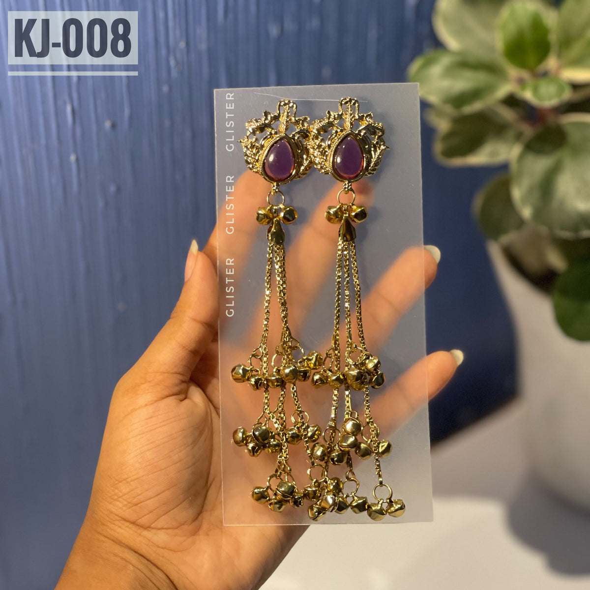 Glister KJ-008: A pair of Kashmiri-inspired long earrings with ornate tops and teardrop-shaped colored accents, hanging chains and clusters of small bell-like drops.