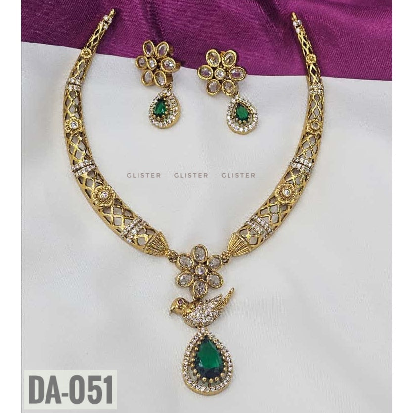Glister DA-051: A lattice-pattern necklace with a floral centerpiece, a bird motif and a green teardrop pendant, paired with matching floral earrings, alternate view.