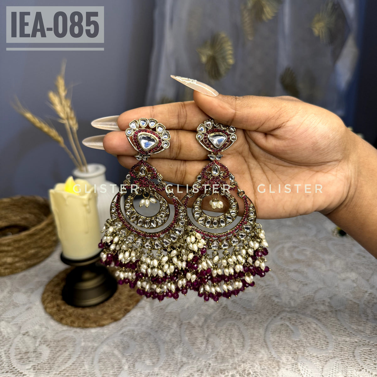 Teardrop earrings with clear accents and dark pink bead clusters. IEA-085.
