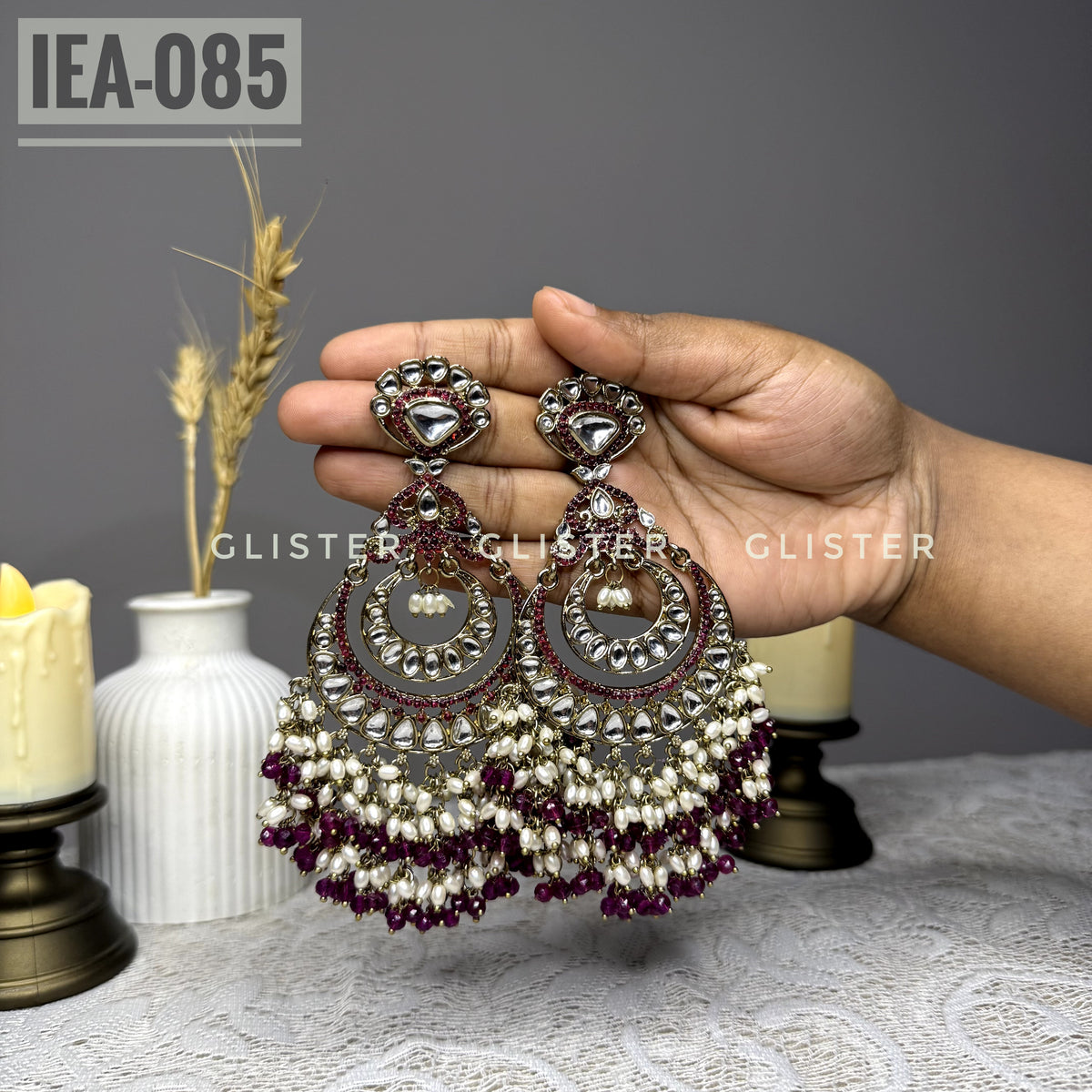 Teardrop earrings with clear accents and dark pink bead clusters. IEA-085.