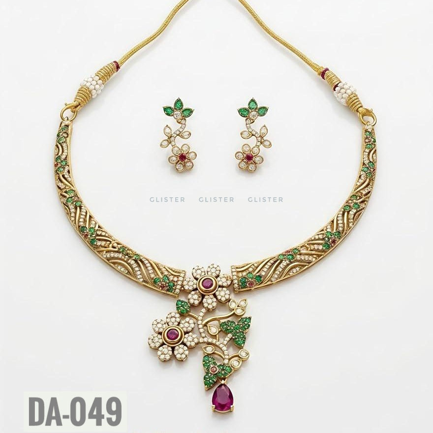 Glister DA-049: A curved patterned necklace with floral and leaf details, a pink teardrop pendant and matching floral drop earrings, alternate view.