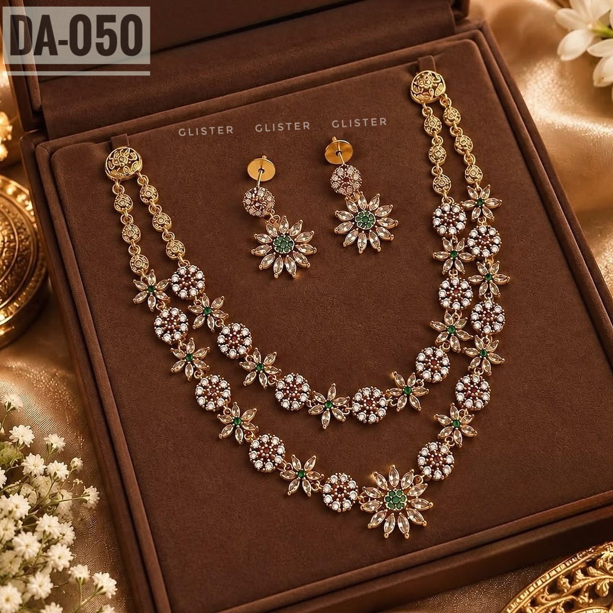 Glister DA-050: A double-strand floral necklace with alternating round clusters and flower motifs, paired with matching floral drop earrings.