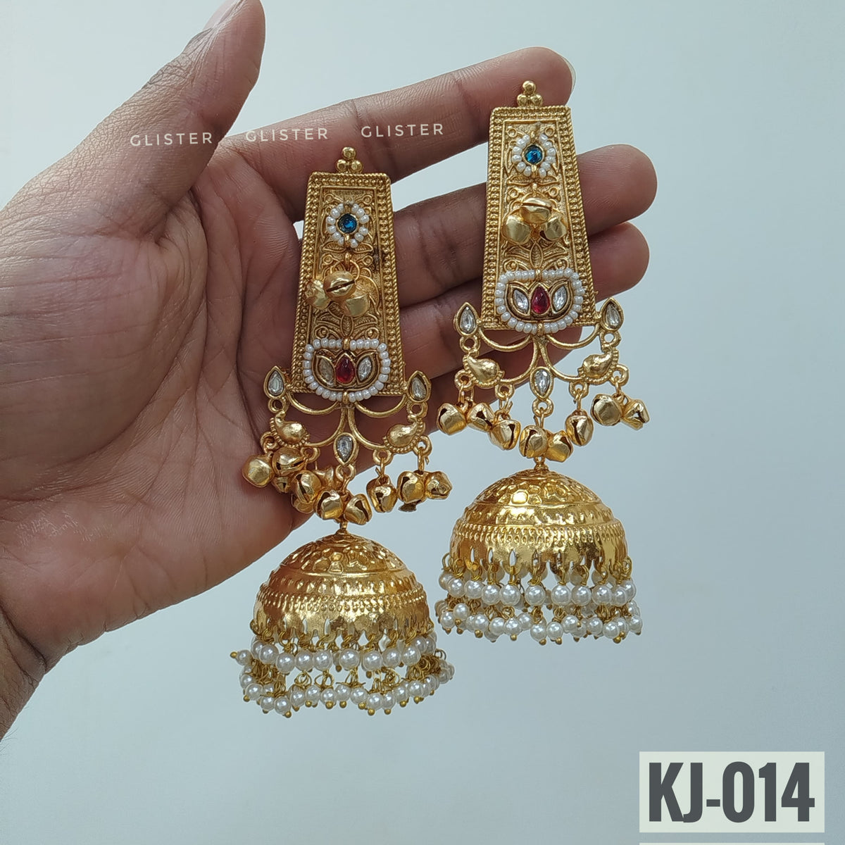 Glister KJ-014: Long rectangular earrings with blue floral accents, small hanging charms and large bell-shaped drops edged with white beads.