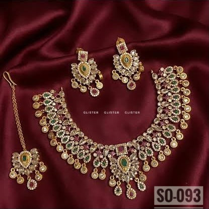 Gold-tone wide choker with colored accents, bead fringe, earrings and a forehead ornament