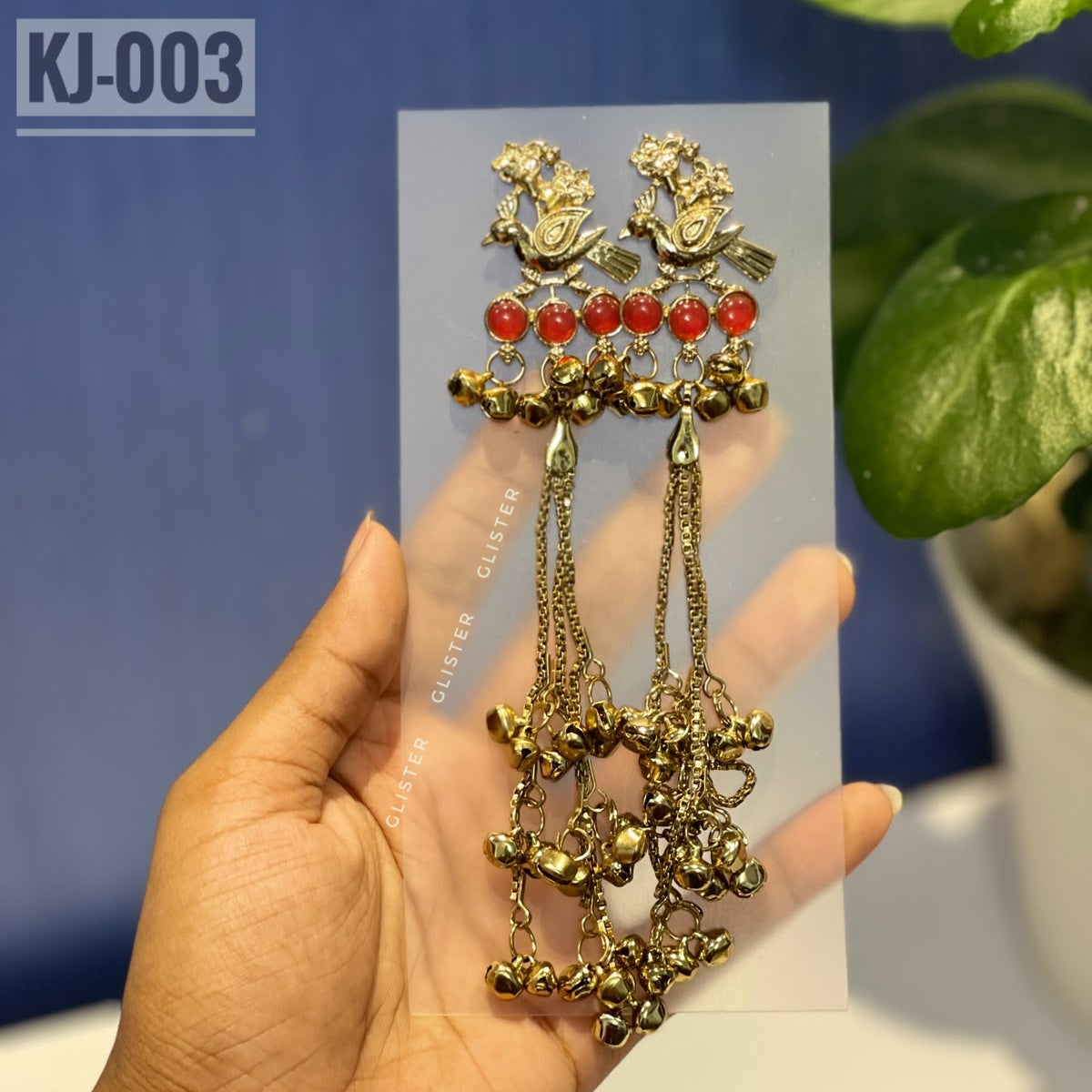 Glister KJ-003: A pair of Kashmiri-inspired long earrings with peacock-inspired tops and round colored accents, hanging chains and clusters of small bell-like drops.